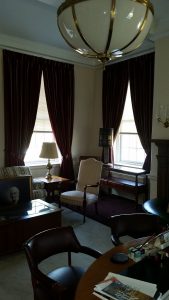 Corner window pinch pleated draperies with tie backs