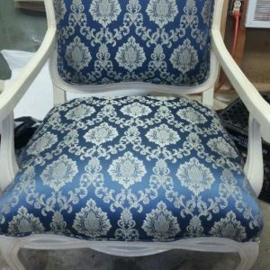 Reupholstered occasional chair with cut out back 