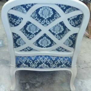 Reupholstered occasional chair with cut out back 