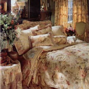 Button tufted comforter, shams and pillows with coordinating table cover with bullion fringe.
