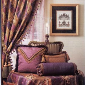 Various styles of decorative throw pillows and trims coordinating with drapery panel and table cover.