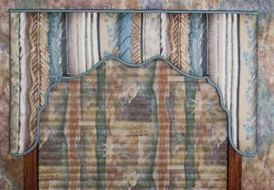 Shaped lambrequin over coordinating pleated shade.