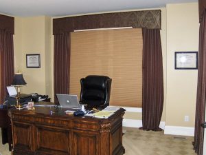 honeycomb shade, shaped cornice, puddled drapes