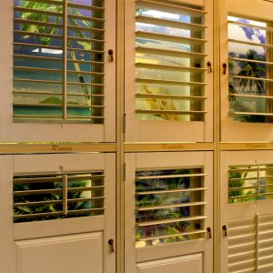 N J Rose Decorating showroom shutter display that depicts various styles of available plantation shutters.