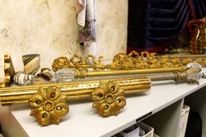 Custom decorative curtain rods and tie back holders for window treatments.