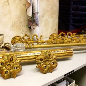Custom decorative curtain rods and tie back holders for window treatments.