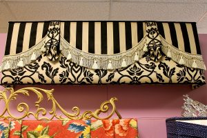 N J Rose Decorating showroom display of contrasting fabrics and trims.