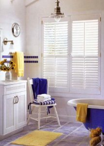 Double panel plantation shutters with tilt bars.