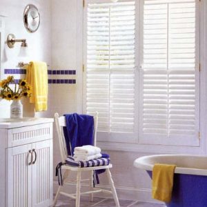 Perfect application of 2 panel plantation shutter with visible tilt bars – 1 panel open to the right and 1 panel open to the left.