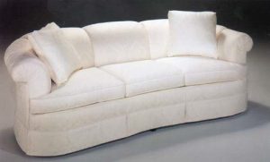 Cream colored contemporary style sofa.