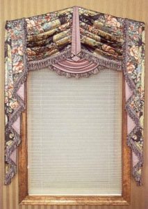 “V” pointed swag valance with center pelmet and contrasting under swag with stacked style jabots.