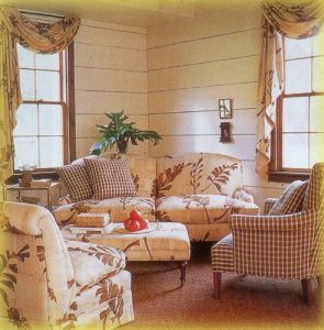 Casual swag valance with one side jabot coordinating with furniture.