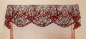 Empire swag with contrast lined pelmets and brush fringe.