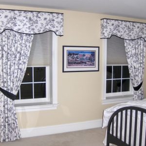 toile shaped cornice over one way pulled back drapery