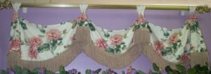 Tapered Squire Valance mounted on decorative curtain rod.