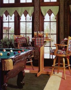V-point window valance in contrasting fabrics and welting with tassels.