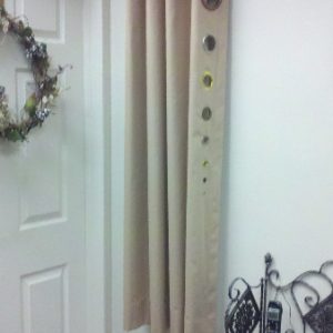 Example of Grommet drapery showing different size grommets available.